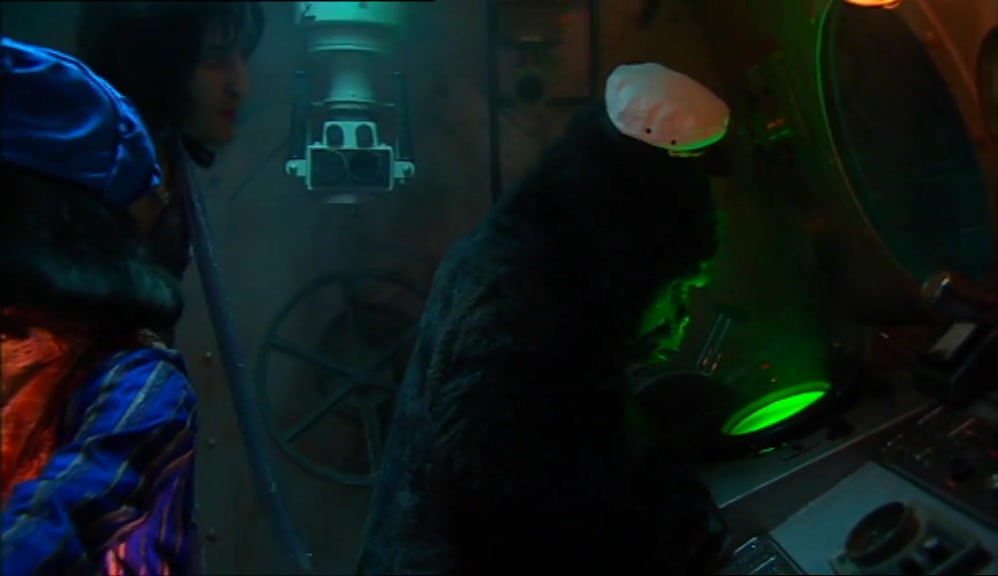 HE'S PLAYING PAC-MAN.  