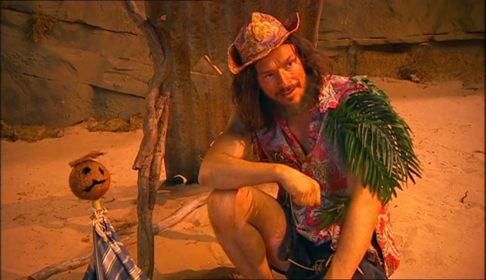 WHY IS HE DRESSED IN THAT STRIPY TEA TOWEL?  