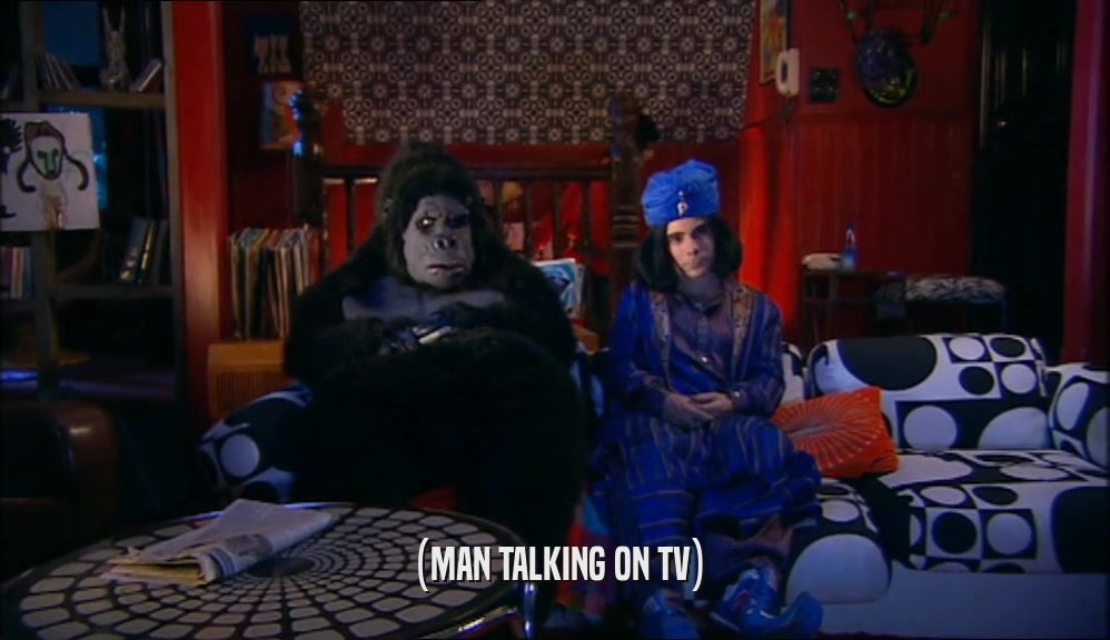 (MAN TALKING ON TV)  