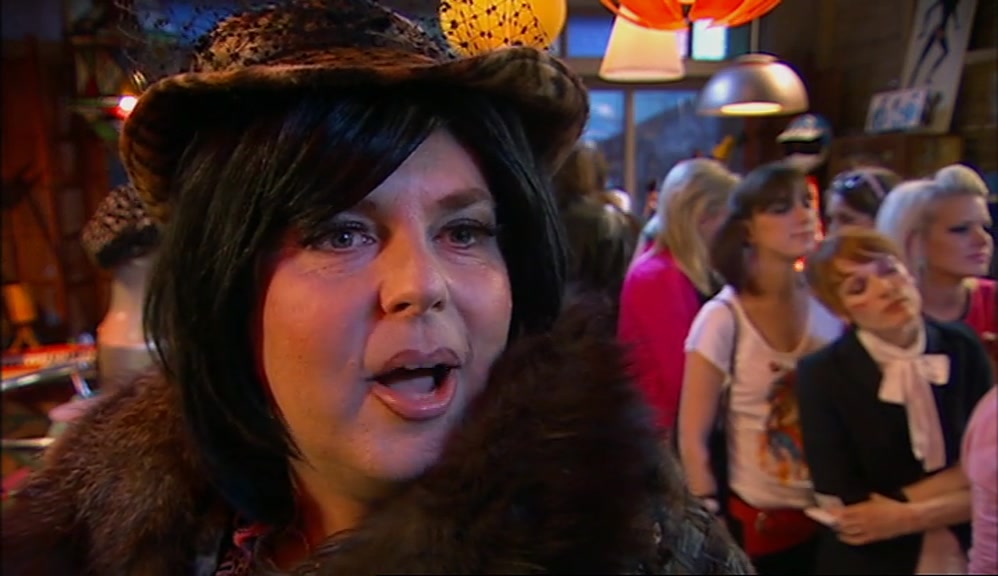 DON'T BE COY, COWBOY. I'M TALKING ABOUT THE ADVERT. 