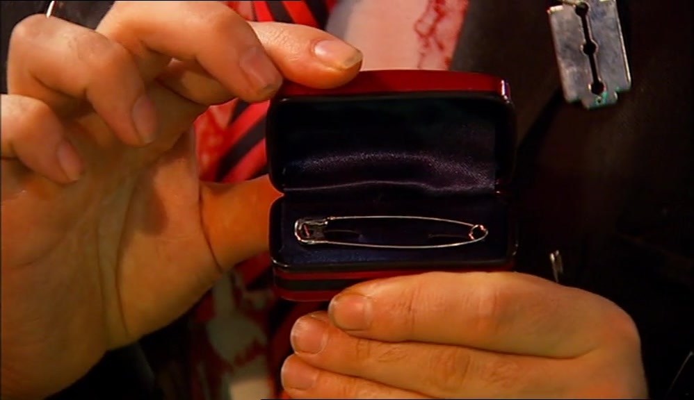 IS THAT ONE OF MY SAFETY PINS? IT SHOULD BE TUCKED AWAY IN SAFETY PIN COTTAGE. 