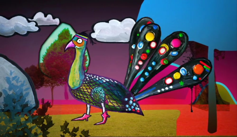 THE PEACOCK HAD BEAUTIFUL PLUMAGE -  