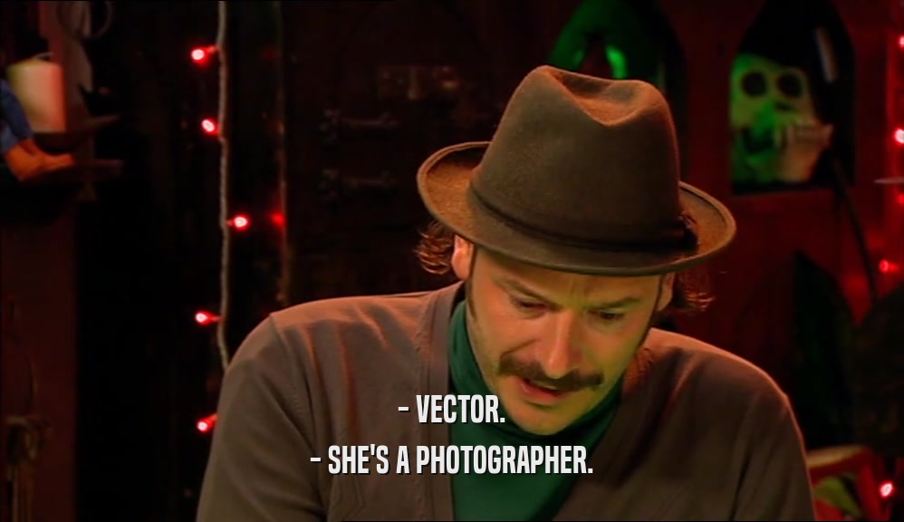 - VECTOR.
 - SHE'S A PHOTOGRAPHER.
 