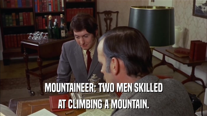 MOUNTAINEER: TWO MEN SKILLED AT CLIMBING A MOUNTAIN. 