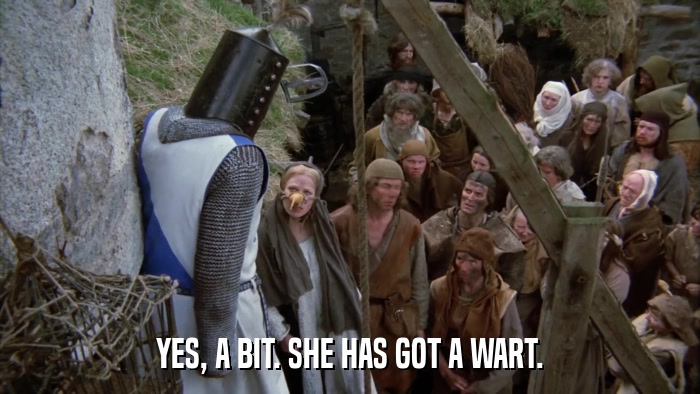 YES, A BIT. SHE HAS GOT A WART.  