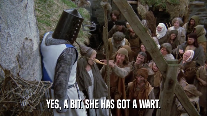 YES, A BIT. SHE HAS GOT A WART.  