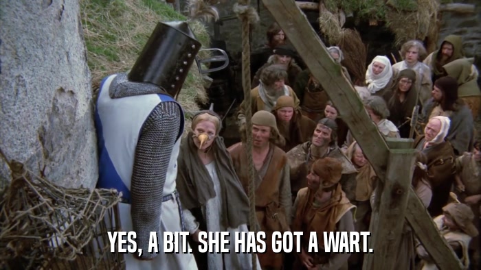 YES, A BIT. SHE HAS GOT A WART.  