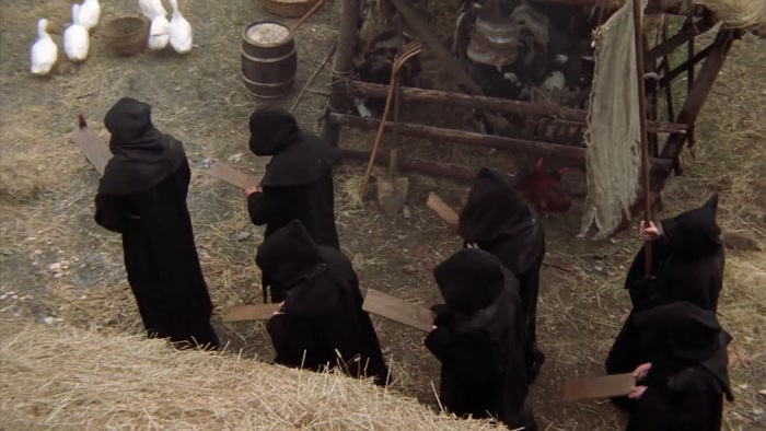 WOMAN: A WITCH! MAN: WE FOUND A WITCH. 