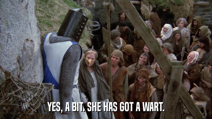 YES, A BIT. SHE HAS GOT A WART.  