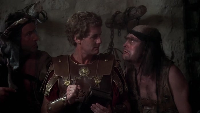 GET A MOVE ON, BIG NOSE! THERE'S PEOPLE WAITING TO BE CRUCIFIED OUT HERE! 