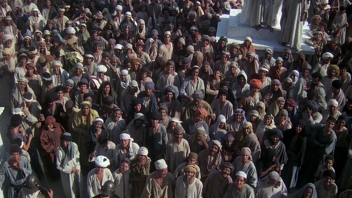 [ CROWD GROWS QUIET ]  