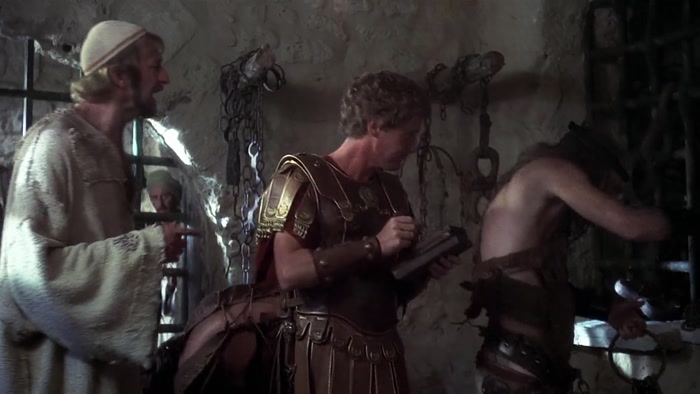 EXCUSE ME? THERE'S BEEN A MISTAKE. JUST A MOMENT, WOULD YOU? JAILER? 