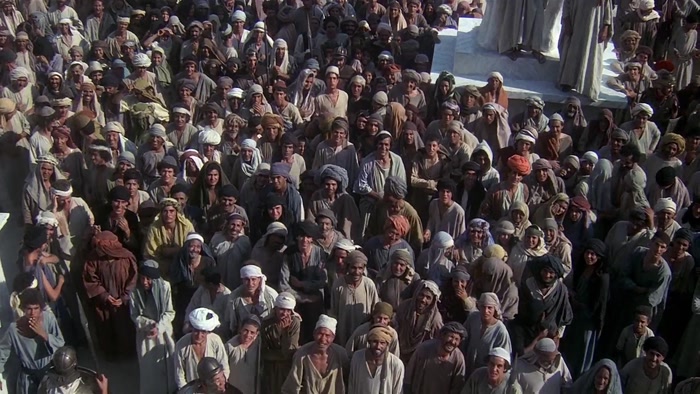 [ CROWD GROWS QUIET ]  