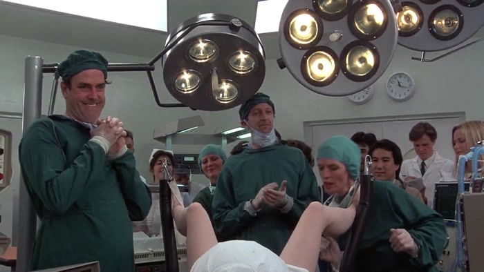 OH, THE VULVA'S DILATING, DOCTOR. OH, YES, THERE'S THE HEAD. 