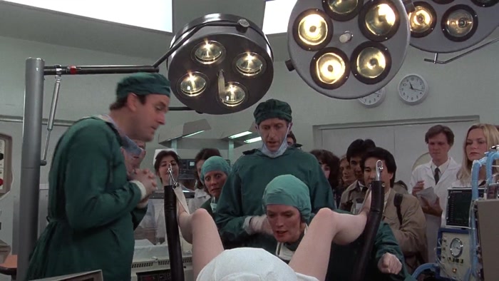 OH, THE VULVA'S DILATING, DOCTOR. OH, YES, THERE'S THE HEAD. 