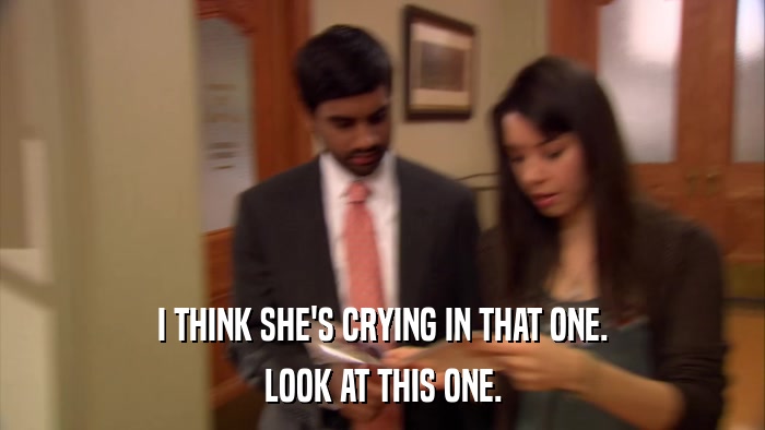 I THINK SHE'S CRYING IN THAT ONE. LOOK AT THIS ONE. 