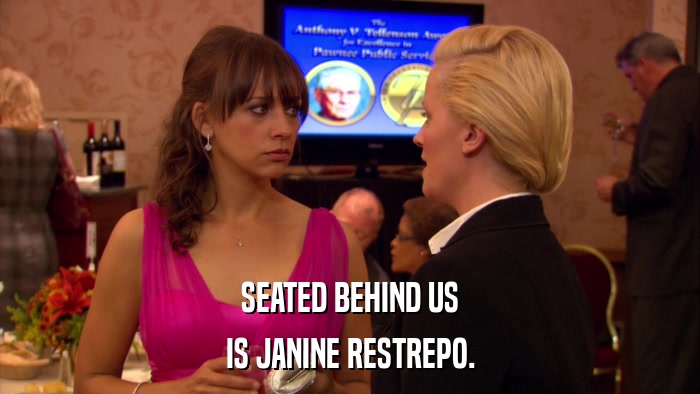 SEATED BEHIND US IS JANINE RESTREPO. 