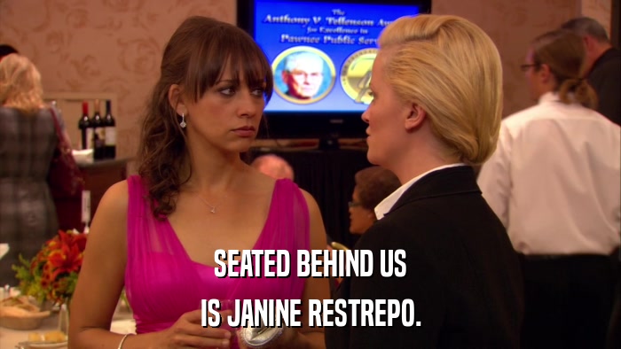 SEATED BEHIND US IS JANINE RESTREPO. 
