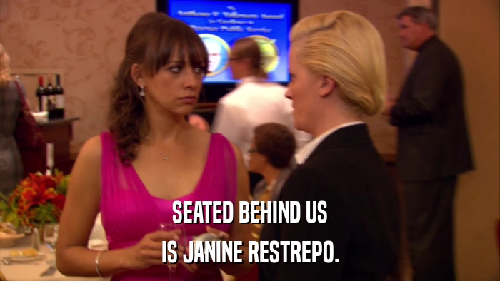 SEATED BEHIND US IS JANINE RESTREPO. 