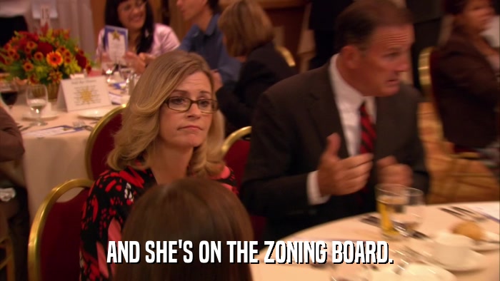 AND SHE'S ON THE ZONING BOARD.  