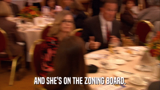 AND SHE'S ON THE ZONING BOARD.  
