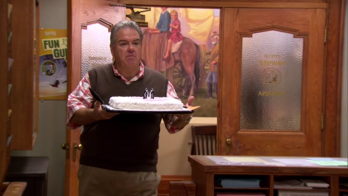 HEY, LESLIE, SOME GUY WHO OWNS A GAY BAR SENT YOU A CAKE. 