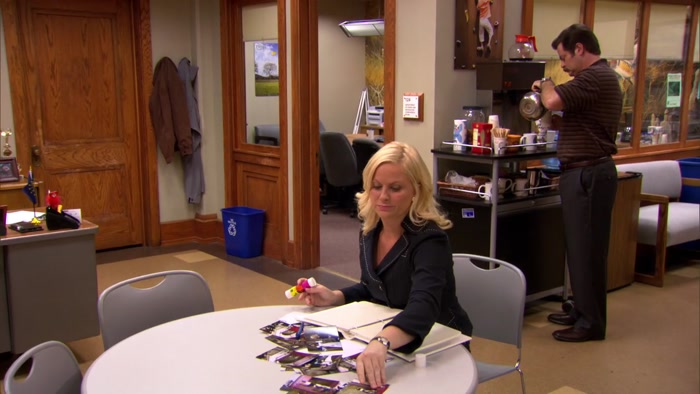 HEY, LESLIE, SOME GUY WHO OWNS A GAY BAR SENT YOU A CAKE. 