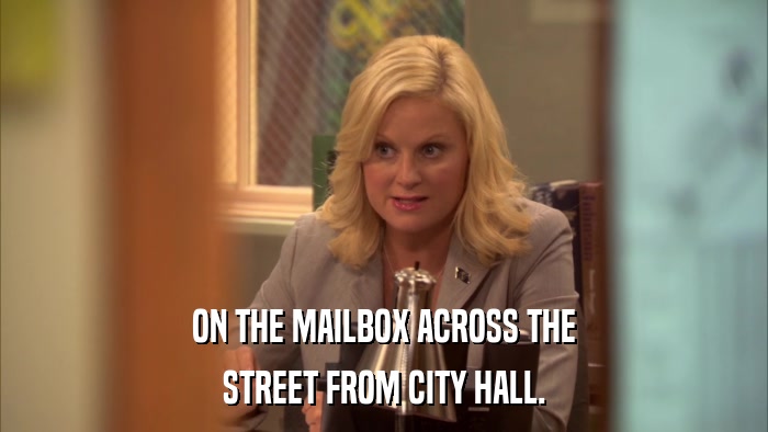 ON THE MAILBOX ACROSS THE STREET FROM CITY HALL. 