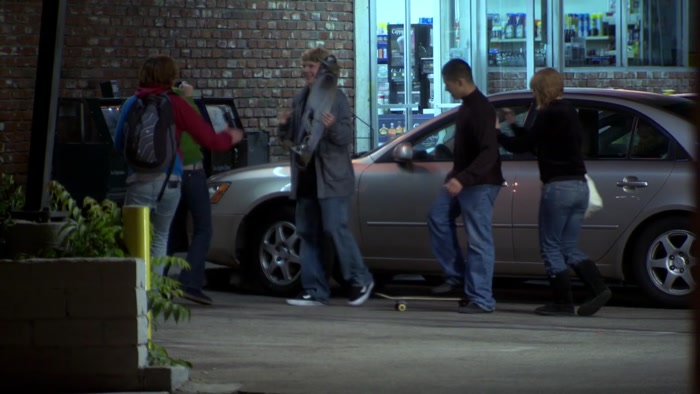 SUSPECT LAUGHING WITH FRIENDS AND PLAYING WITH HIS STUPID SKATEBOARD 