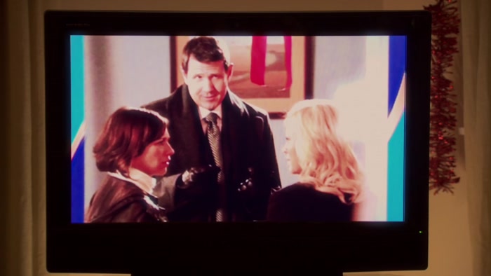 SHE AND KNOPE ARE STANDING VERY CLOSE TO EACH OTHER, 