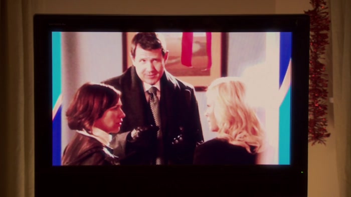 SHE AND KNOPE ARE STANDING VERY CLOSE TO EACH OTHER, 