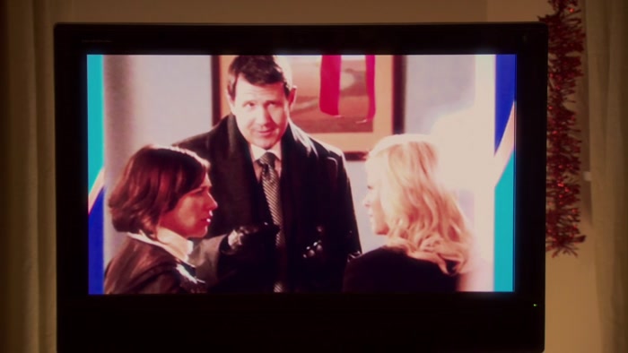 SHE AND KNOPE ARE STANDING VERY CLOSE TO EACH OTHER, 