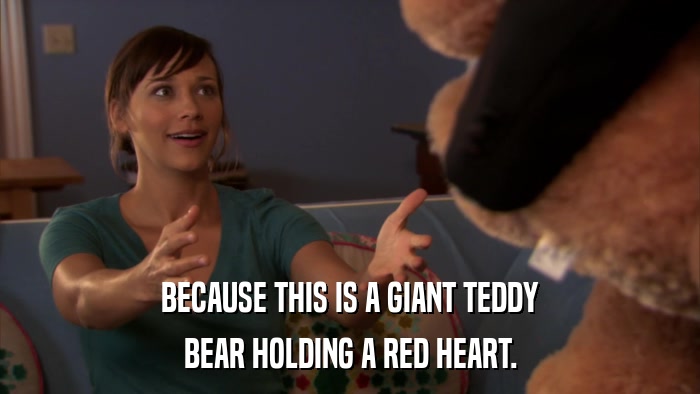 BECAUSE THIS IS A GIANT TEDDY BEAR HOLDING A RED HEART. 