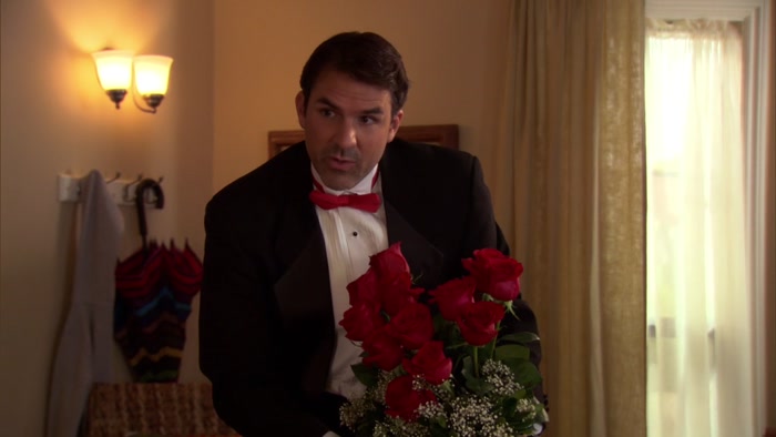 THAT'S A DOZEN RED ROSES IN A HEART-SHAPED ARRANGEMENT. 