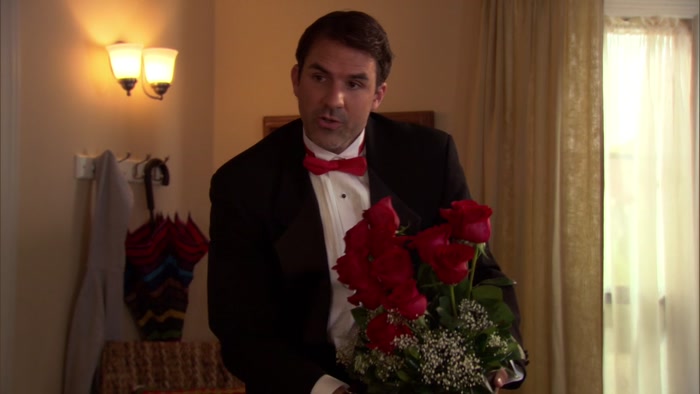 THAT'S A DOZEN RED ROSES IN A HEART-SHAPED ARRANGEMENT. 