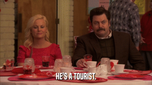HE'S A TOURIST.  