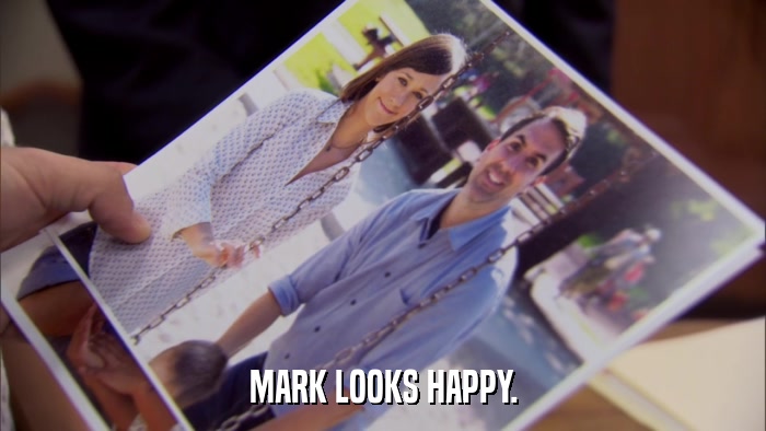 MARK LOOKS HAPPY.  