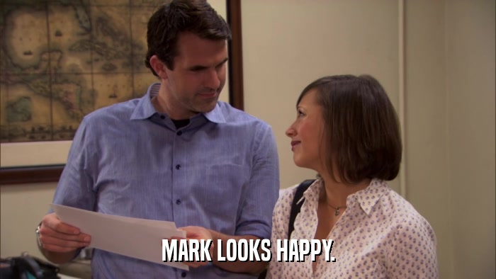 MARK LOOKS HAPPY.  