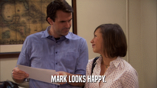MARK LOOKS HAPPY.  