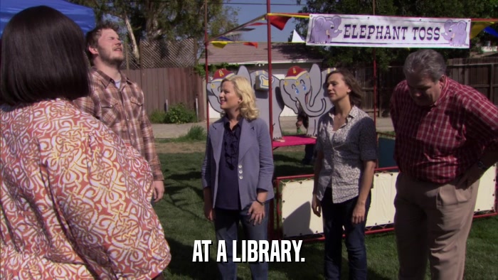 AT A LIBRARY.  