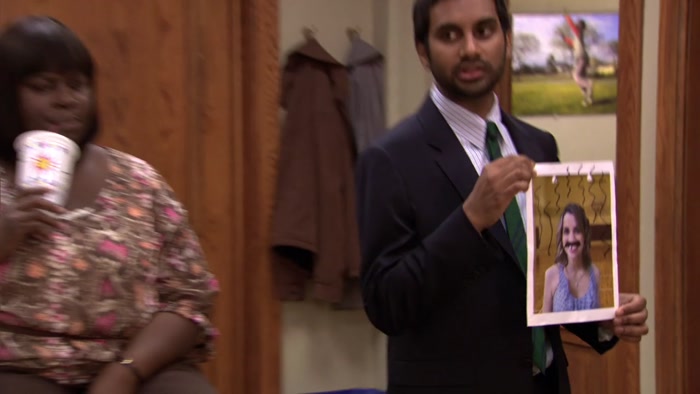 WITH A MUSTACHE DRAWN ON HER FACE 