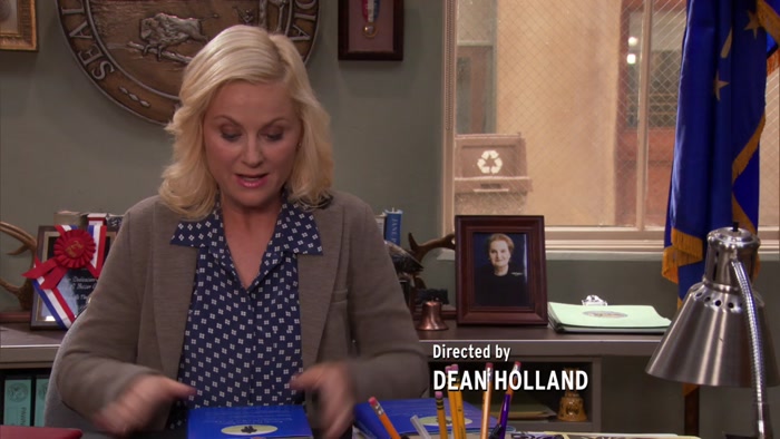 THEN JOAN SLAPS HER STICKER ON IT, 