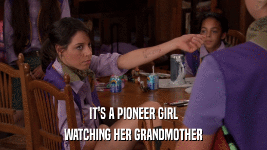 IT'S A PIONEER GIRL WATCHING HER GRANDMOTHER 