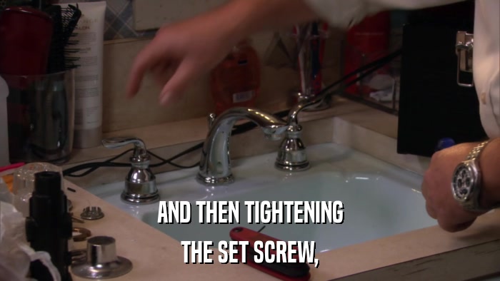 AND THEN TIGHTENING THE SET SCREW, 