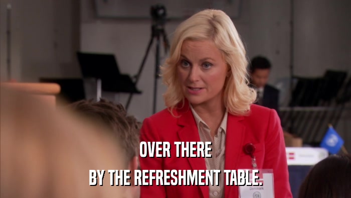 OVER THERE BY THE REFRESHMENT TABLE. 