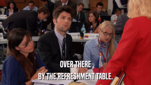 OVER THERE BY THE REFRESHMENT TABLE. 