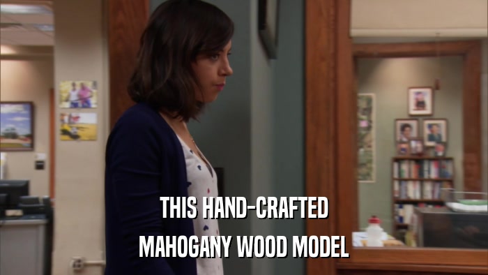 THIS HAND-CRAFTED MAHOGANY WOOD MODEL 
