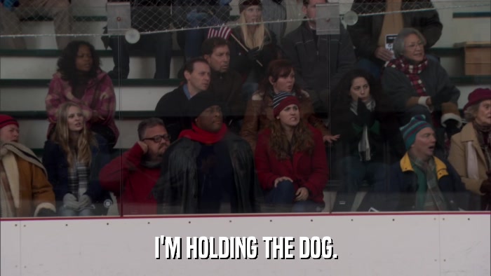 I'M HOLDING THE DOG.  
