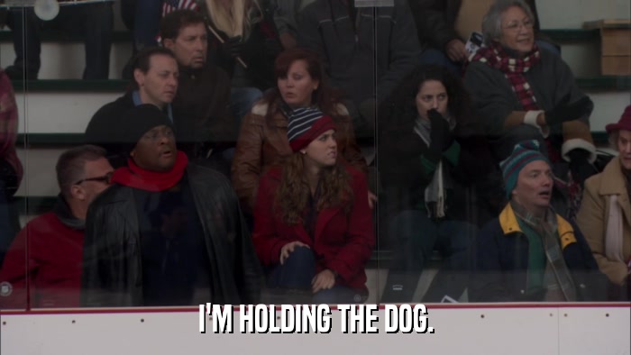 I'M HOLDING THE DOG.  