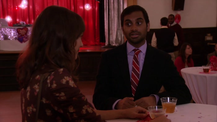 WE'RE STUCK AT A PARKS AND REC COMMUNITY COUPLES EVENT. 